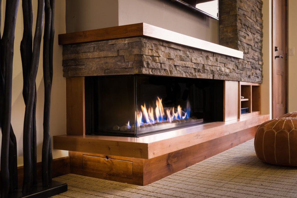 A 130 Left Sided Fireplace Surrounded by Traditional Materials