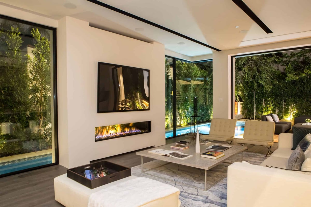 7 Reasons to Stand in Awe of the Indoor Outdoor See Through Fireplace