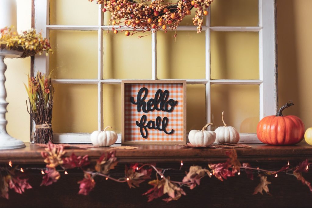 fall decorations on the fireplace mantel
